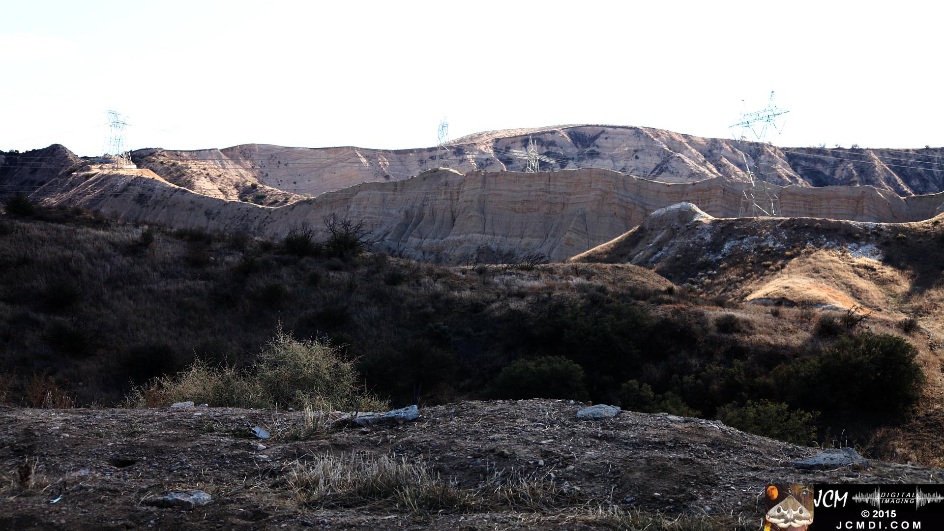 Landslide, buckled pavement, and terrain at Vasquez Canyon Road in Santa Clarita, CA filmed 11-25-2015